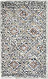 Close-up of Nourison Quarry Blue Ivory Southwestern rug. Diamond pattern in chestnut, blue, and ivory. Machine made.