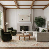 Living room scene with a Nourison Maison Ivory Rust Vintage rug, sofa, and green armchairs.