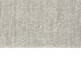Close-up of Calvin Klein Home Lowland Basalt Rug. Handmade wool rug with a textured, dotted, vertical stripe design.