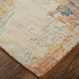 Close-up of Feizy Jaxson rug. Abstract design in gray, ivory, and orange on a textured wool blend. Corner