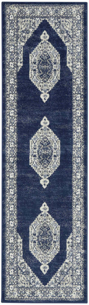 Close-up of Nourison Cyrus Ivory Navy runner rug. Vintage style with geometric medallion pattern and chestnut accents.