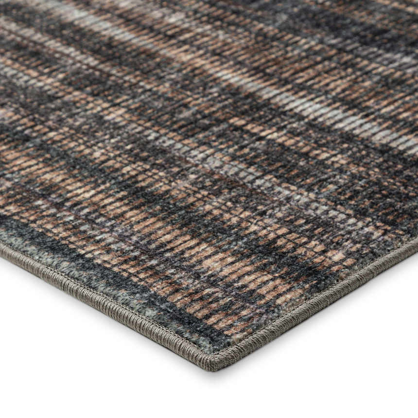 Close-up of the textured Dalyn Amador AA1 Fudge area rug showing brown, taupe, and gray tones.