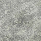 Close-up of Dalyn Aberdeen AB1 Flannel Washable Area Rug. Gray and taupe tones with a subtle traditional pattern.