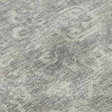 Close-up of Dalyn Aberdeen AB1 Flannel Washable Area Rug. Gray and taupe tones with a subtle traditional pattern.