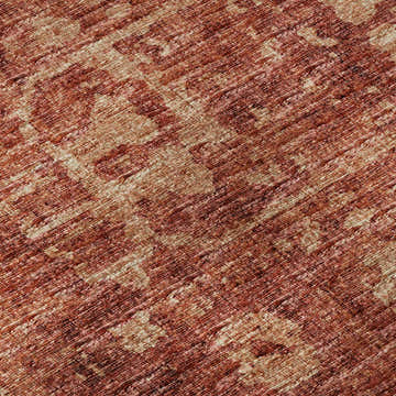 Close-up of Dalyn Aberdeen AB2 Paprika Washable Area Rug. Paprika, red, and taupe hues with a textured, machine-made design.