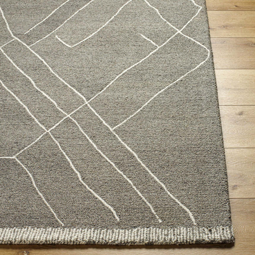 Close-up of the Livabliss Arsenal rug. Hand-tufted wool rug in cream and medium gray with a geometric line pattern. Front