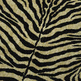 Close-up of the Dalyn Akina AK1 Gold Washable Area Rug featuring a bold black and gold zebra stripe pattern.