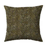 Close-up of a Dalyn Akina AK2 Gold Washable Area Rug showing its black and gold leopard print pattern and soft texture.