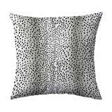 Close-up of Dalyn Akina AK3 Ivory Washable Area Rug, showcasing the black dotted pattern on a light background.