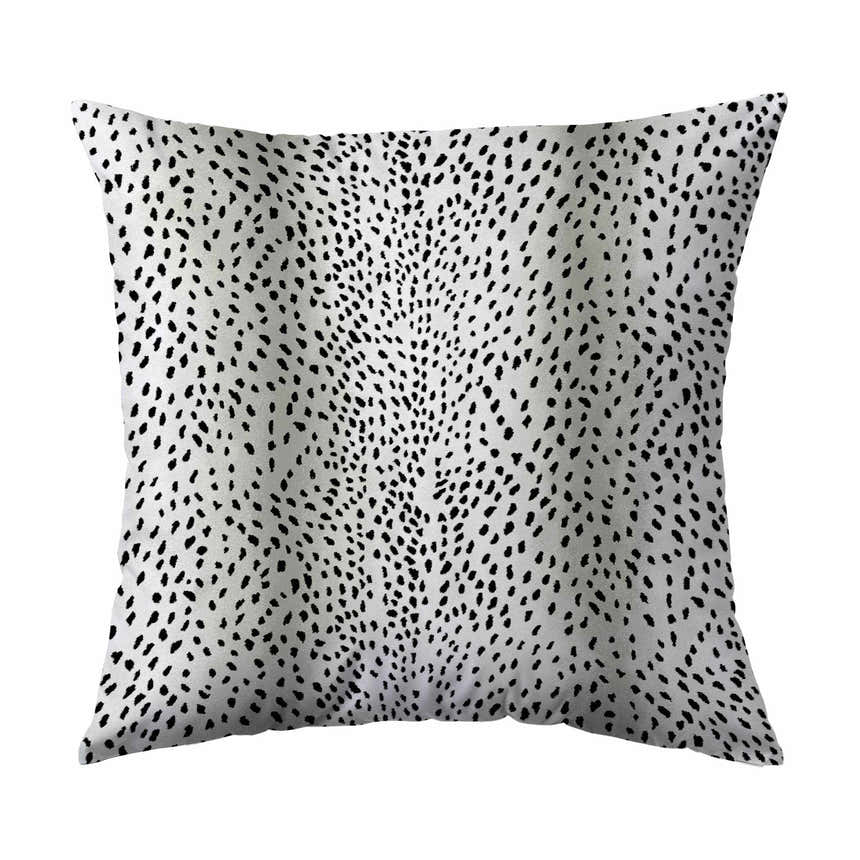 Close-up of Dalyn Akina AK3 Ivory Washable Area Rug, showcasing the black dotted pattern on a light background.