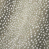 Close-up of Dalyn Akina Stone Washable Area Rug. Chestnut rug with ivory, abstract spot pattern. Casual style.