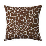 Chocolate brown throw pillow with a giraffe print. Animal print pillow with brown spots and white lines.