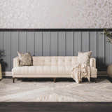 Living room scene with a beige sofa on a geometric Akiye Area Rug in cream, beige, and gray. Roomscene-Rectangle