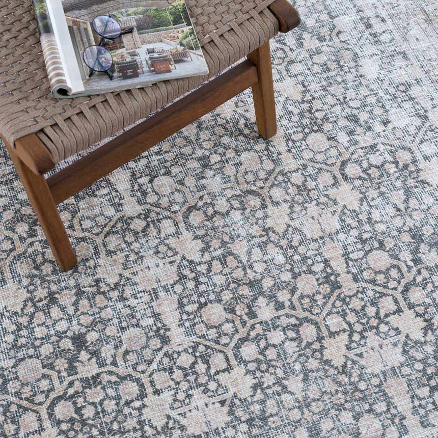 Close-up of the Hedda Boutique Washable Rug. Gray, brown, and nutmeg vintage-style floral pattern. Traditional farmhouse rug. Styleshot