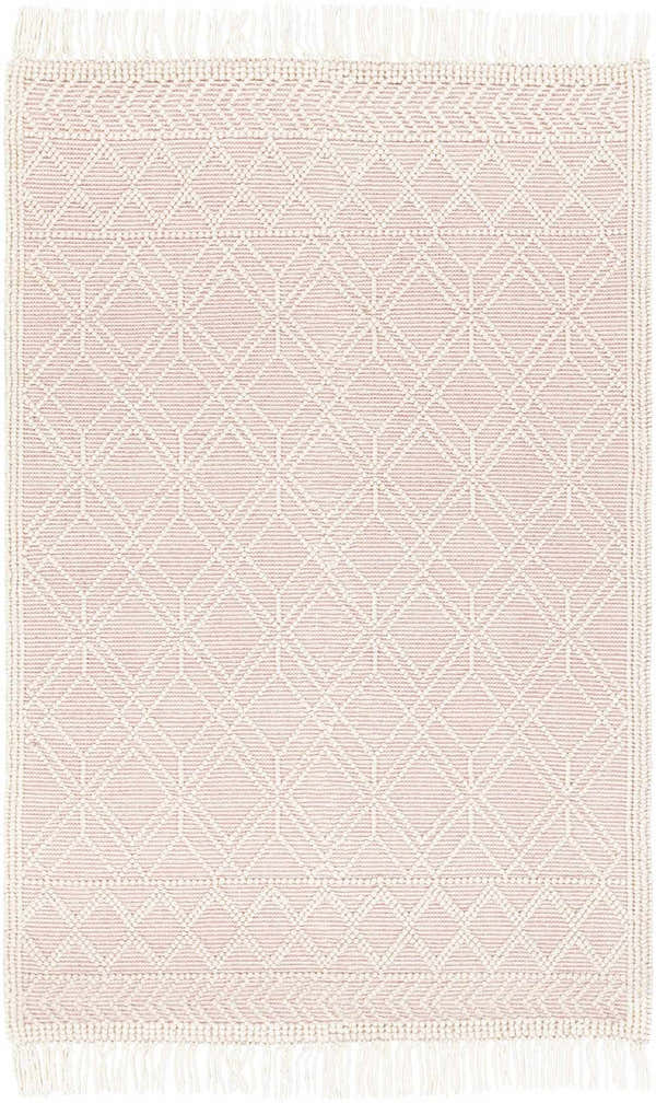Close-up of the Ramsbury Soft Pink Wool Rug. Features a geometric diamond pattern and fringe detail. Farmhouse style. Design-Rectangle