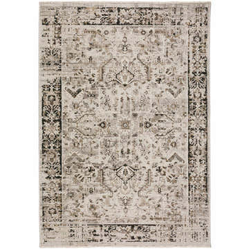 Detailed view of the Dalyn Antalya AY4 Silver Area Rug. Beige, gray, and tan traditional rug with a distressed pattern.