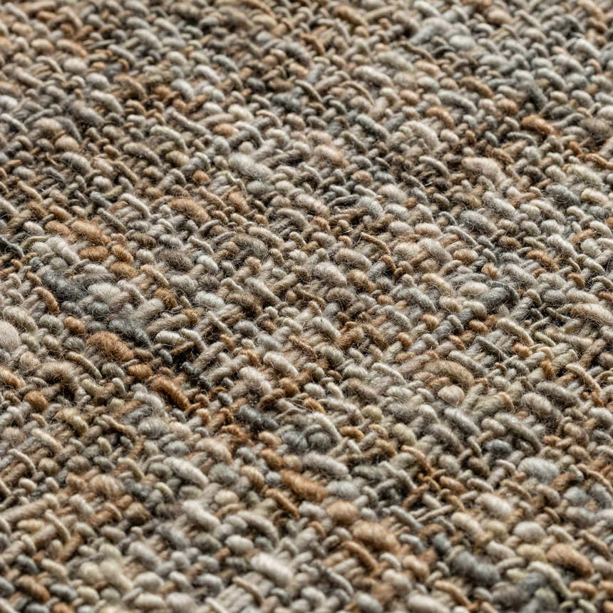 Close-up of the textured, hand-loomed Dalyn Abruzzo AZ1 Putty Area Rug in beige, brown, and taupe wool.