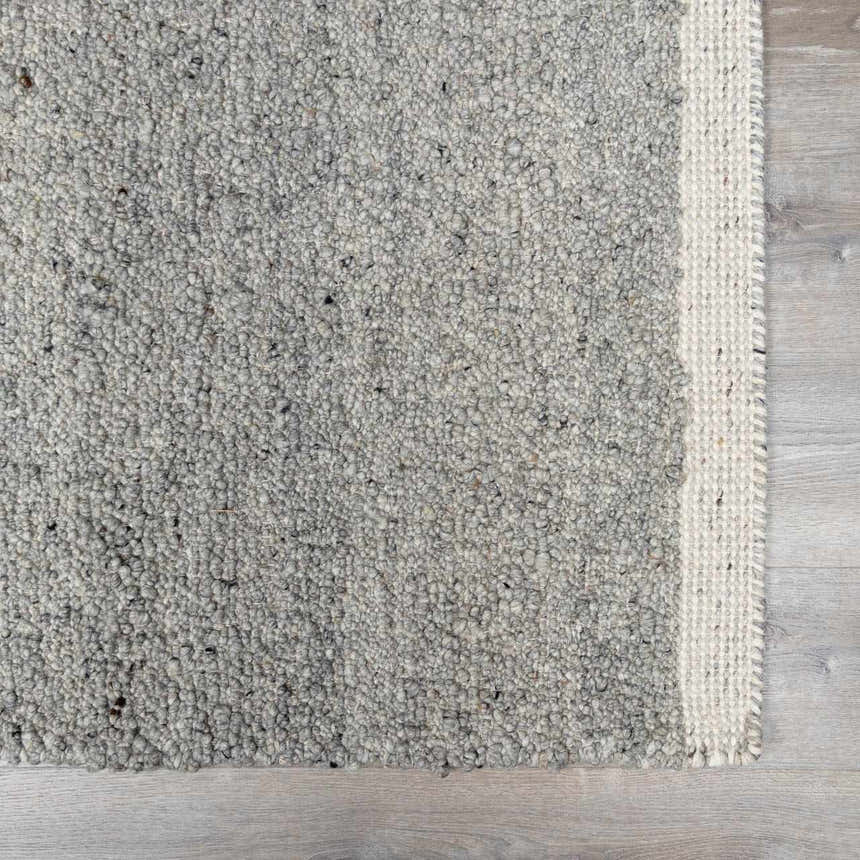 Close-up of the hand woven Basiao Area Rug. Charcoal and cream wool and cotton blend with a textured, contemporary design. Swatch