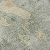 Close-up of Dalyn Luxury Bresca Seafoam Washable Area Rug. Aloe and gold abstract pattern on a textured, sage green background.