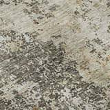 Close-up of Dalyn Luxury Bresca BC5 Terracotta Washable Area Rug. Beige, burnt orange, and dark brown abstract pattern.