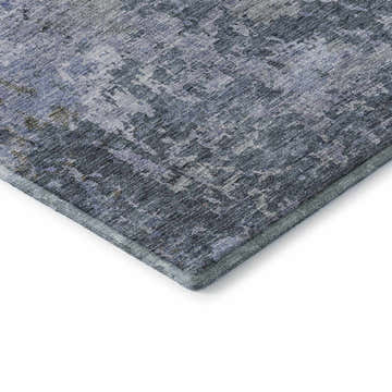 Close up of the Dalyn Luxury Bresca BC6 Blue Washable Area Rug, showing denim, light blue, and silver gray tones.