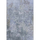 Close-up of the Dalyn Luxury Bresca BC6 Blue Washable Area Rug. Features a distressed denim, gray, and light blue pattern.