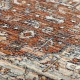 Close-up of the Dalyn Bergama BE1 Paprika Area Rug showing its traditional pattern and texture in brown, ivory, and navy.