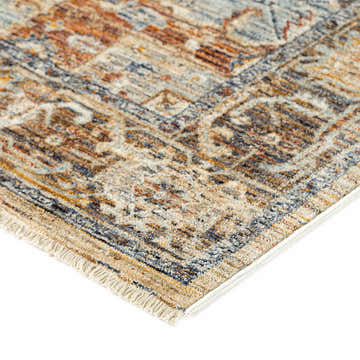 Close up of the Dalyn Bergama BE2 Riverview rug showing beige, chestnut, blue, and spice colors with a traditional pattern.
