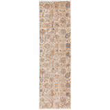 Close-up of the traditional Dalyn Bergama BE5 Ivory Area Rug with beige, chestnut, blue, and paprika floral pattern.