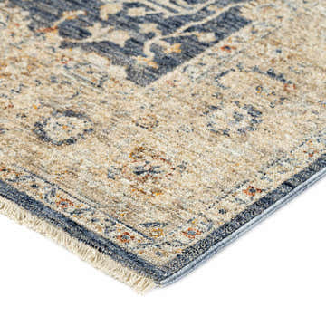 Close up of the traditional Dalyn Bergama BE8 Navy Area Rug, featuring beige, navy, and spice colors.
