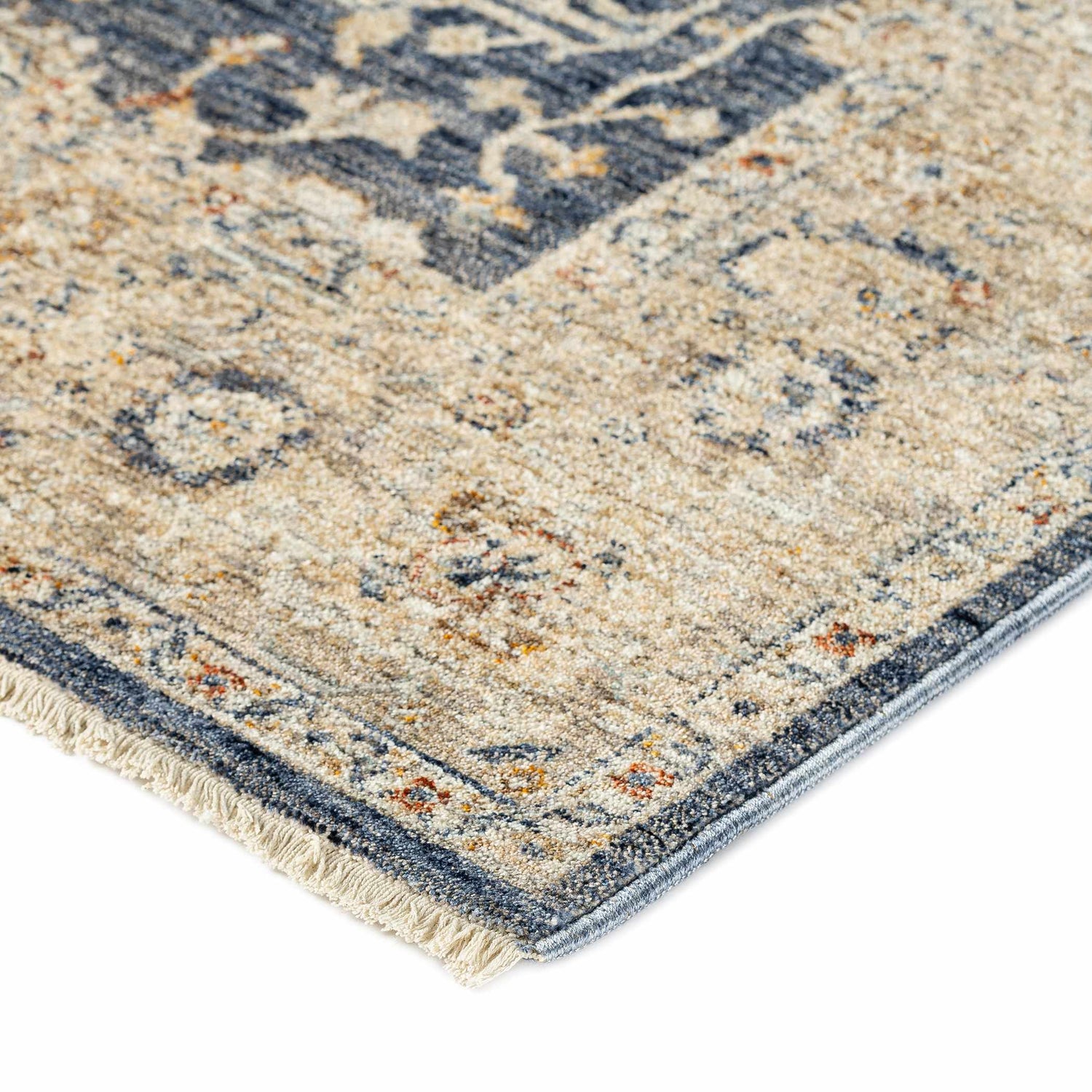 Close up of the traditional Dalyn Bergama BE8 Navy Area Rug, featuring beige, navy, and spice colors.