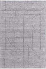 Close-up of the hand-woven Brenta Area Rug. Gray, light silver, and slate blue geometric pattern on a textured, recycled PET yarn. Design-Rectangle-576