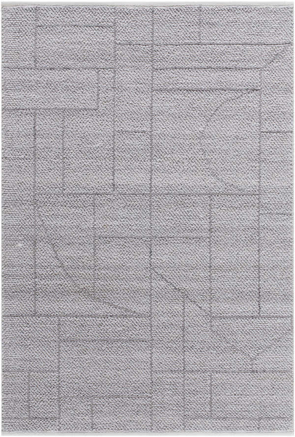 Close-up of the hand-woven Brenta Area Rug. Gray, light silver, and slate blue geometric pattern on a textured, recycled PET yarn. Design-Rectangle-576