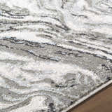 Close-up of the Brandi Gray Marble Area Rug showing its beige, gray, and ice blue contemporary pattern. Texture