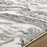Close up of the Brandi Gray Marble Area Rug featuring a contemporary gray, cream, and beige marble pattern. Texture