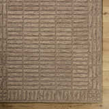 Close-up of the beige Birger Area Rug. Hand-tufted wool rug with a contemporary block pattern and textured design. Corner