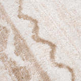 Close up of the Beatus Washable Area Rug. Beige and light brown geometric pattern. Soft texture. Texture
