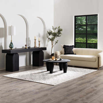 Living room scene with a charcoal and gray Spring Area Rug, cream sofa, and black accent furniture. Roomscene-Rectangle