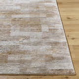 Close-up of the Bridie Luxe Thick Area Rug showing its ivory, tan, and brown contemporary design and plush texture. Front