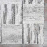 Close up of the Modern Scandi Architect I Area Rug. Ivory rug with a black geometric pattern of lines and squares. Swatch
