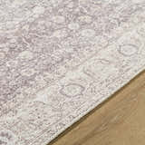 Close-up of the beige and cream Spokane Machine Woven rug showing its traditional pattern and texture. Texture
