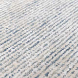 Close-up of the Orcas Hand Tufted Wool-Blend Rug - Slate, showing blue and cream striped pattern and soft, textured pile. Texture