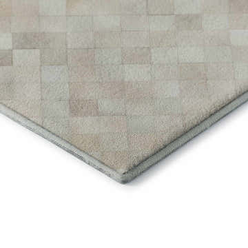 Close-up of the Dalyn Luxury Bozeman BM2 Linen Washable Area Rug. Beige and taupe patchwork design.