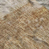 Close-up of the textured Dalyn Luxury Boca BO1 Brown Washable Area Rug, featuring beige, brown, and taupe tones.