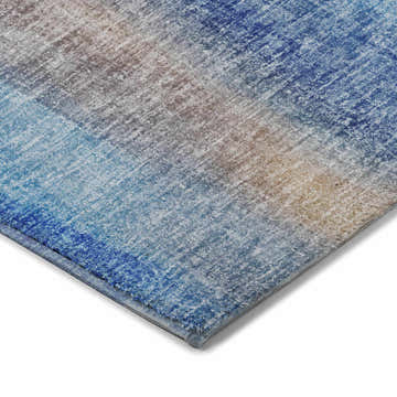 Close up of Dalyn Luxury Boca BO4 Blue Washable Area Rug showing its denim, beige, and light blue textured design.