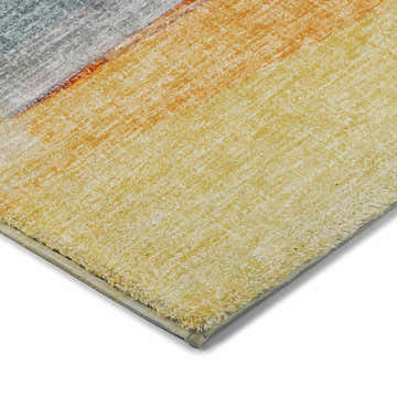 Close-up of the textured Dalyn Luxury Boca BO5 Salmon Washable Area Rug. Colors include salmon, gold, beige, and teal.