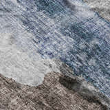 Close-up of the Dalyn Luxury Boca BO6 Pewter Washable Area Rug, showing the denim, ivory, and taupe colors and casual design.