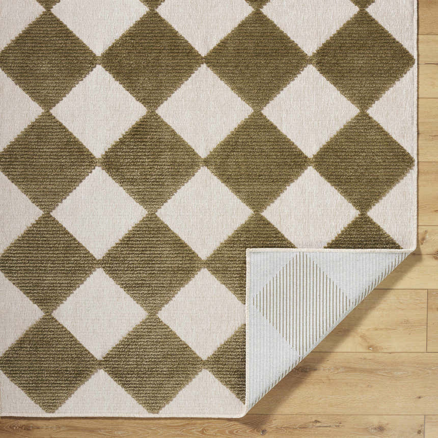Close-up of Bosley Olive Washable Area Rug featuring a geometric diamond pattern in off-white and olive. Machine woven texture. Fold