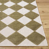 Close-up of Bosley Olive Washable Area Rug featuring a contemporary olive and off-white diamond pattern on wood floors. Front