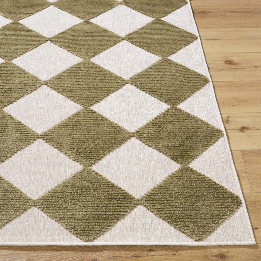Close-up of Bosley Olive Washable Area Rug featuring a contemporary olive and off-white diamond pattern on wood floors. Front